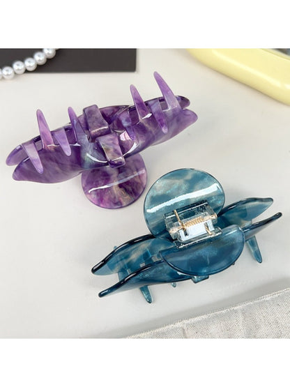 Beau hair claw clip open to display spring mechanism