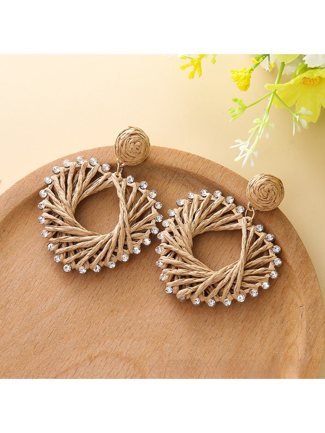 Earedge heart-shaped drop earrings worn on a model's ear