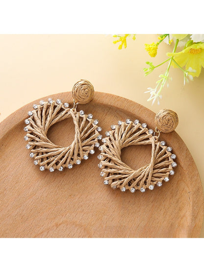 Earedge heart-shaped drop earrings worn on a model's ear