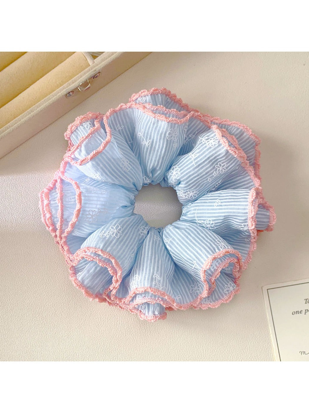 Side view of Gifty Sweet Striped Four Layer Scrunchie with layered fabric design in soft colors