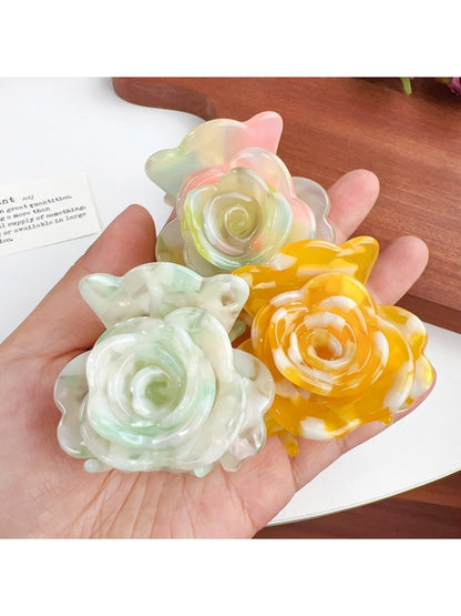 Side view of Beau flower-shaped claw clip highlighting curved petals and clasp mechanism