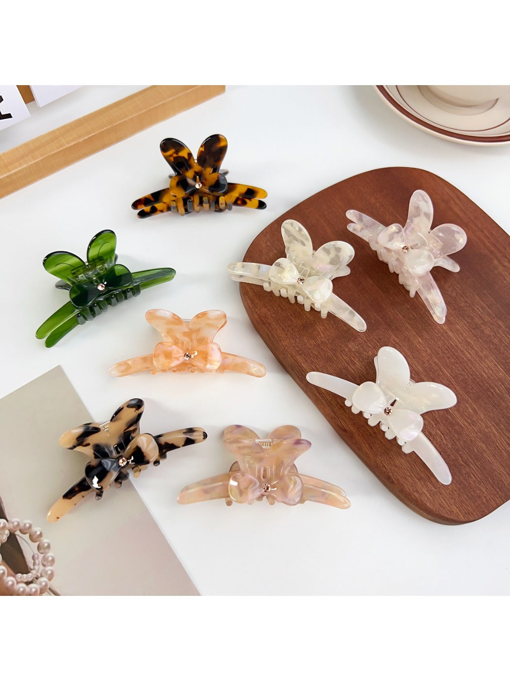 Beau minimalist hair claw clip with a delicate bow detail in neutral color