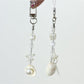 Close-up of Keypus elegant pearlescent keychain charm with silver ring