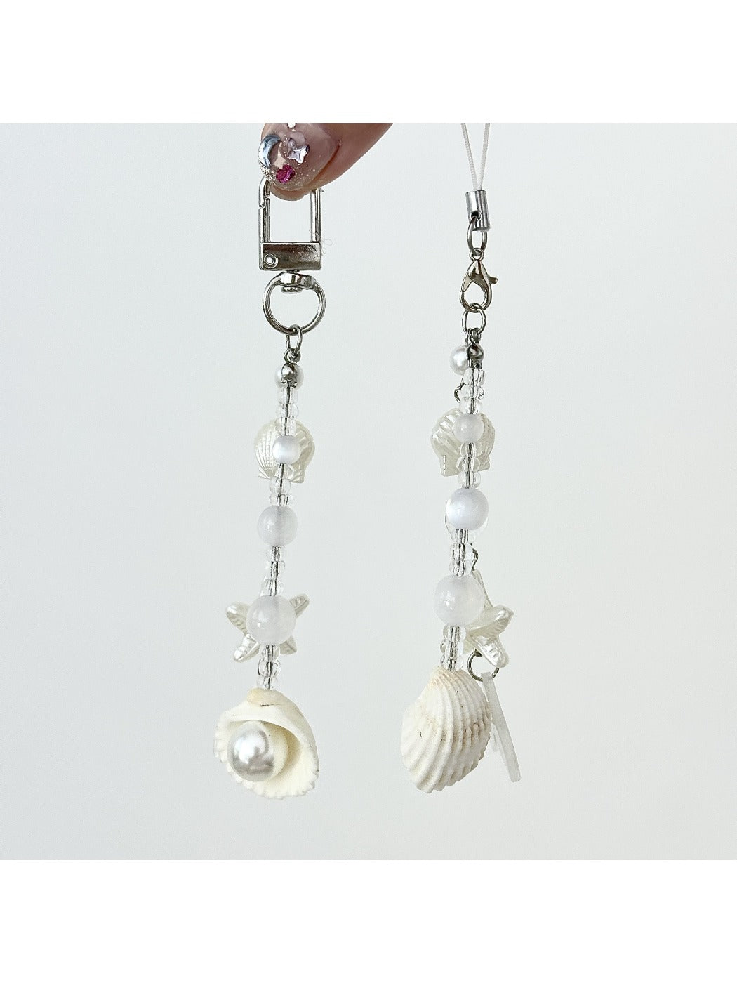 Close-up of Keypus elegant pearlescent keychain charm with silver ring