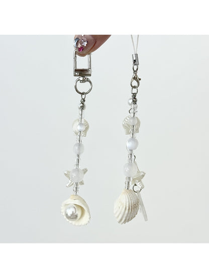 Close-up of Keypus elegant pearlescent keychain charm with silver ring