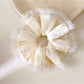 Gifty striped ruched scrunchie styled on a wrist as an accessory