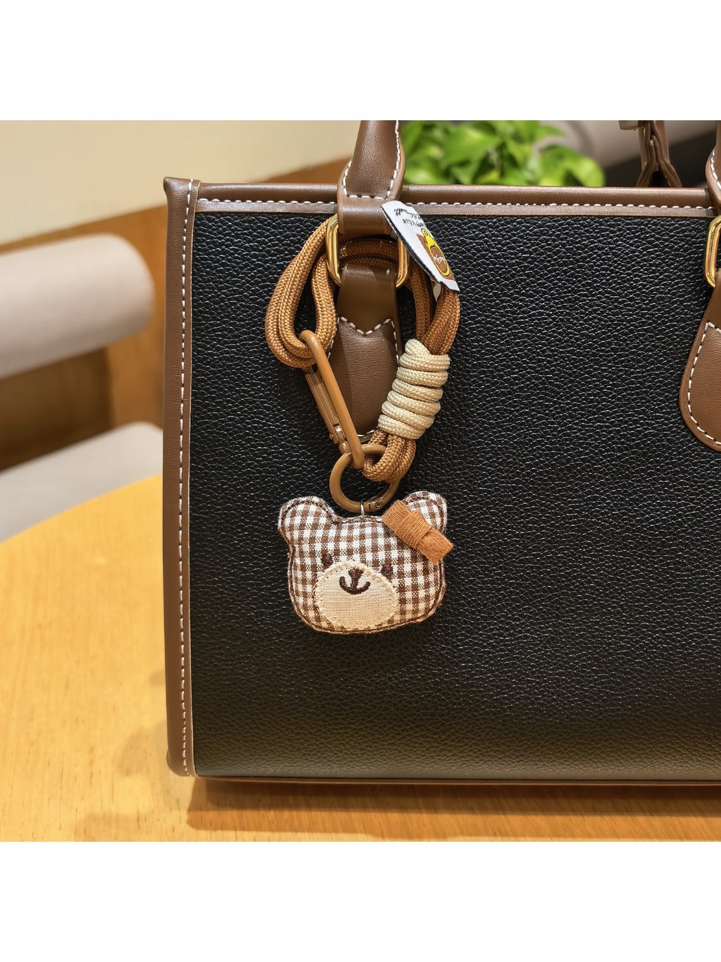 Group of bear charm keychains in different colors displayed on a white background