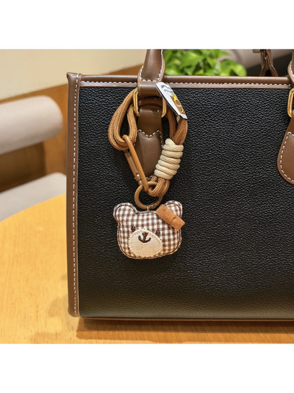 Group of bear charm keychains in different colors displayed on a white background