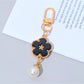 Top view of the colorful flower charm keychain with petals arranged in a circle