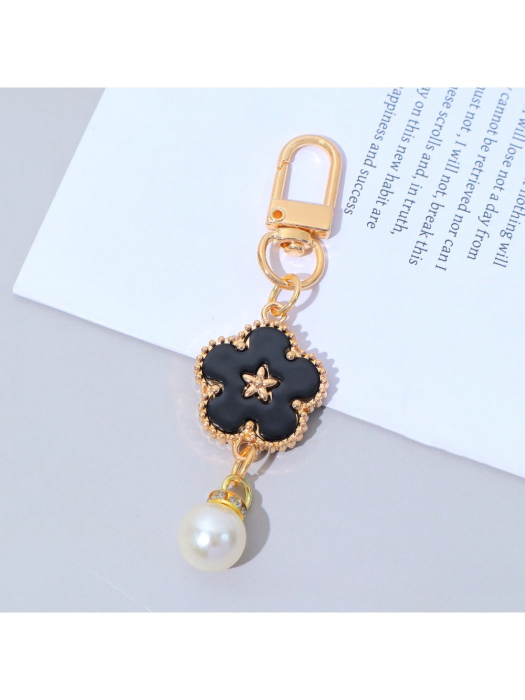 Top view of the colorful flower charm keychain with petals arranged in a circle