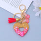 Silver metal heart pendant with cutout design on a keyring
