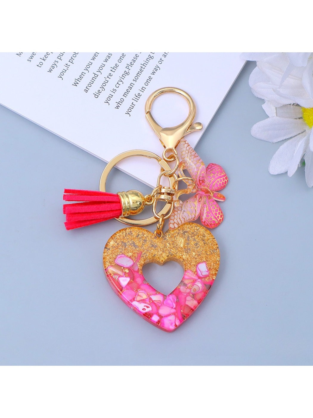 Silver metal heart pendant with cutout design on a keyring