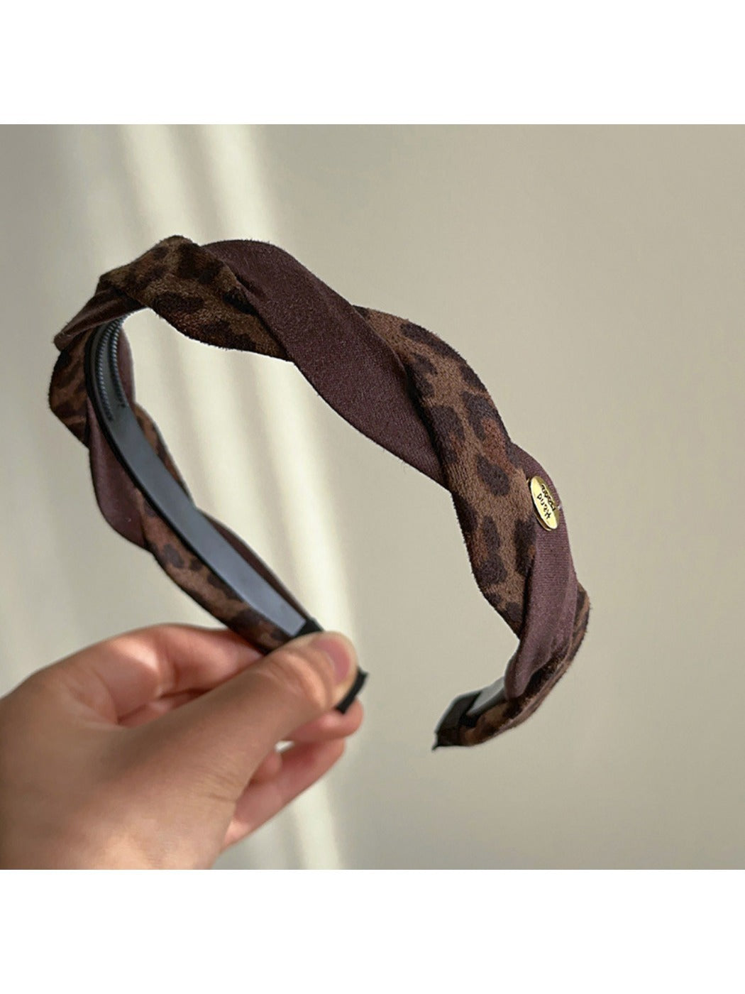 Side view of Gifty retro headband showing its snug fit and pattern