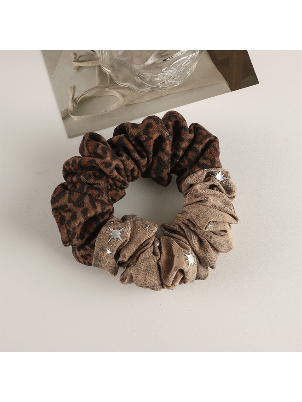 Gifty scrunchie displayed with matching retro-themed accessories on wooden surface