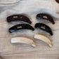 Close-up of Beau minimalist stick hair clip showing smooth matte finish