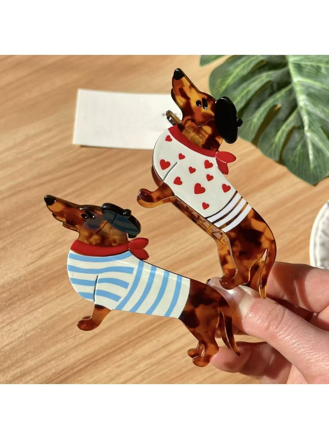 Close-up of Beau dachshund claw clip showing detailed dog face and ears