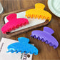Close-up of Beau Candy Polka Dot acetate claw clip showing polka dot pattern