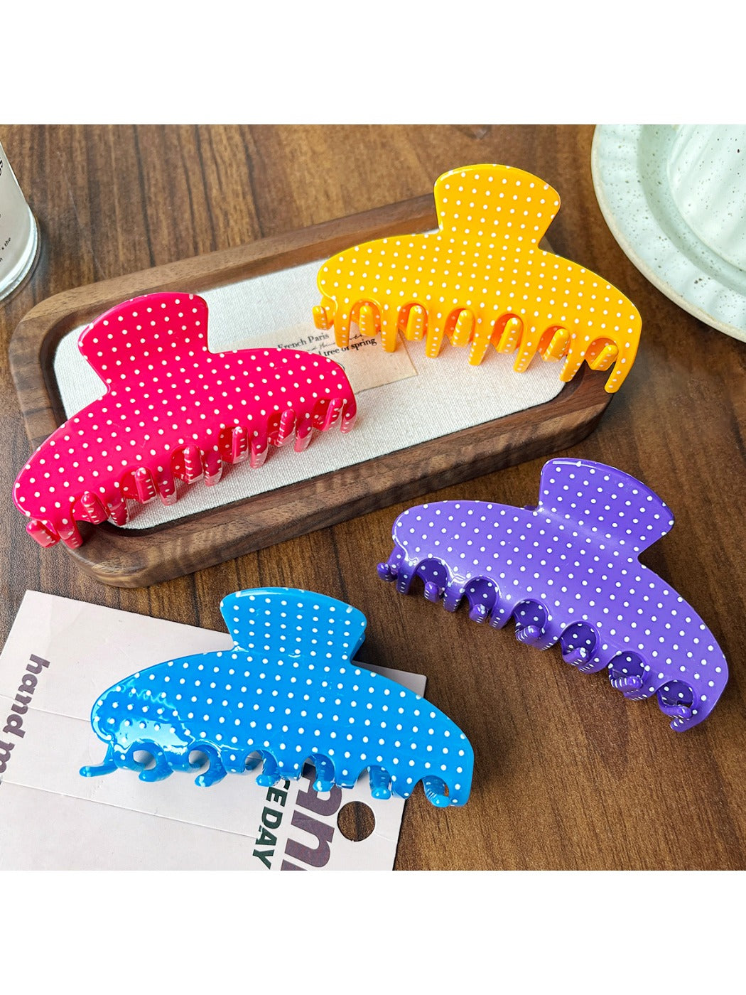 Close-up of Beau Candy Polka Dot acetate claw clip showing polka dot pattern