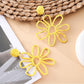 Earedge flower shaped openwork drop earrings shown with matching necklace