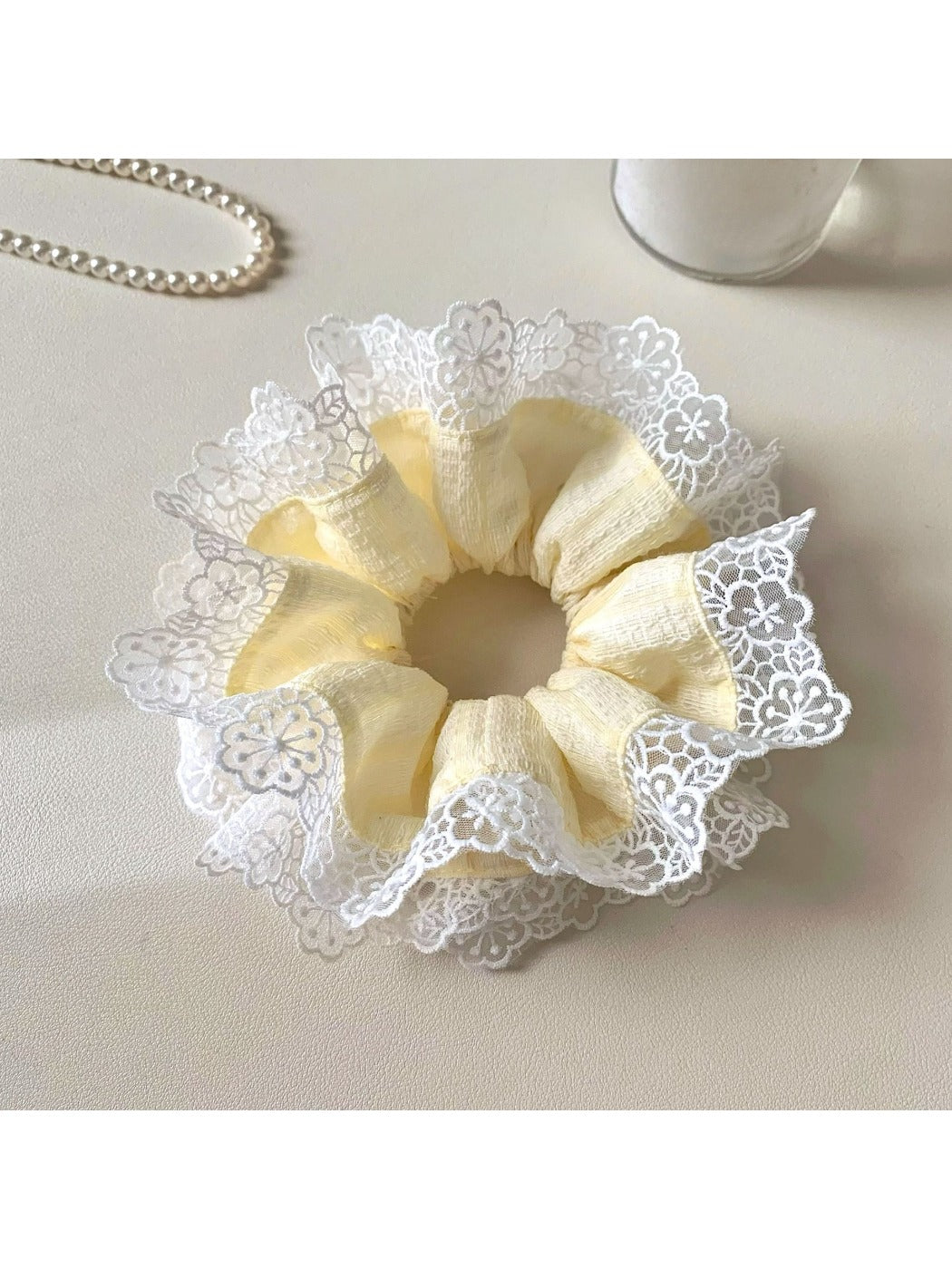 Sweet yellow color block hair scrunchie with soft fabric texture
