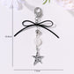 Keypus keychain displayed hanging with star and heart pendants visible