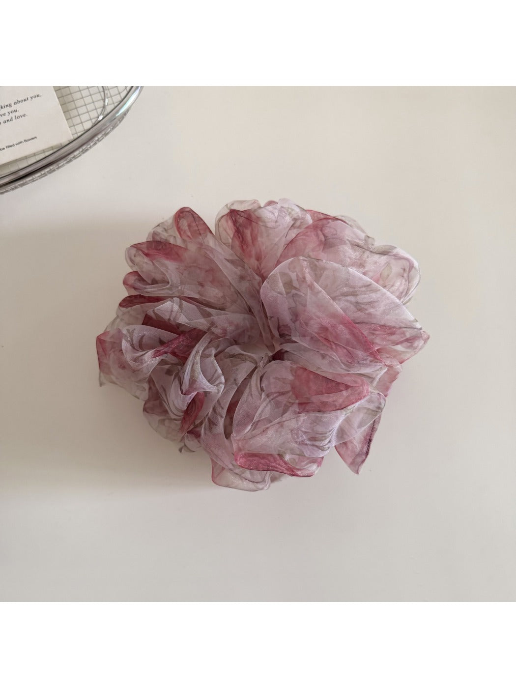 Gifty floral print hair scrunchie packaged in clear plastic with branding visible