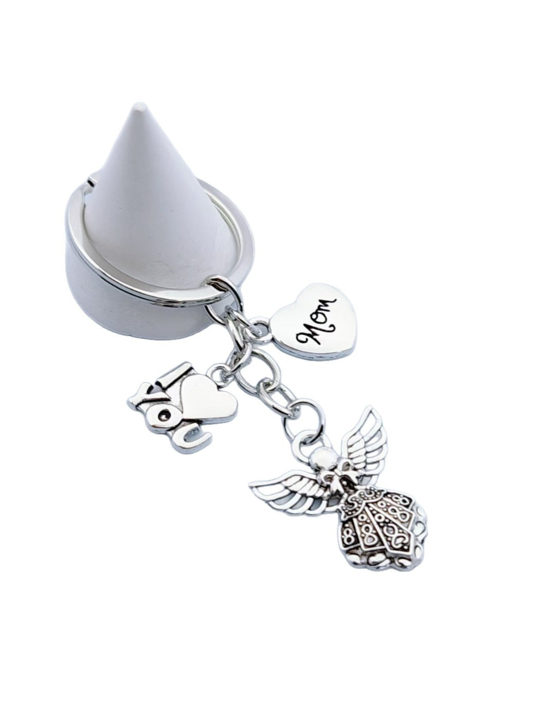 Hand holding the alloy angel shaped keychain with visible keyring