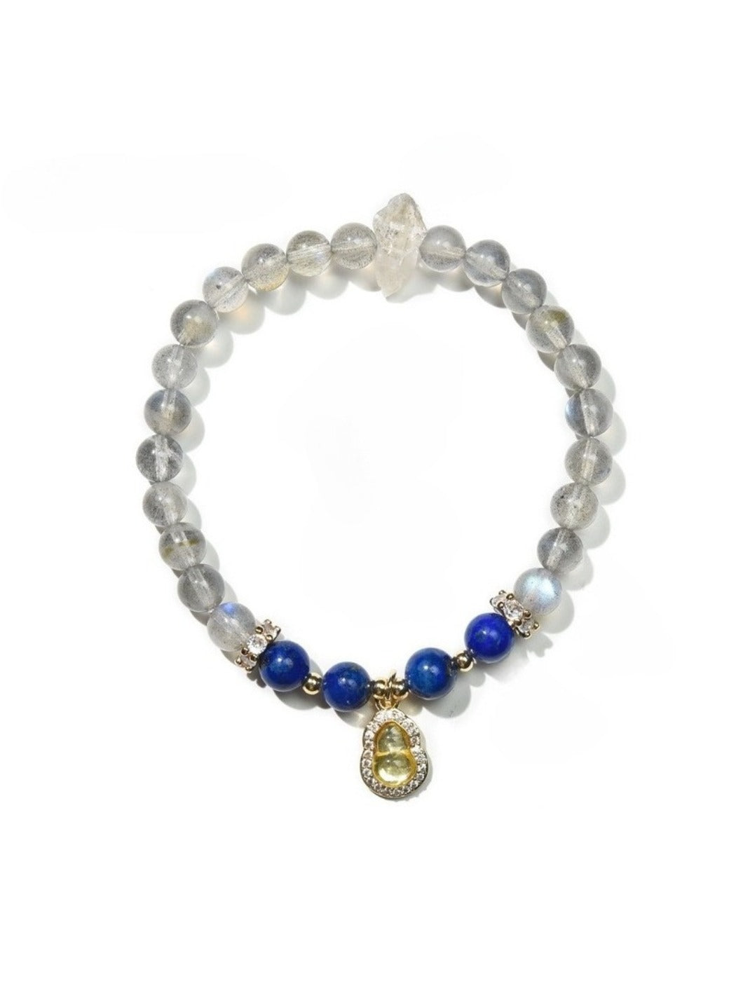 Lovra bracelet arranged with other jewelry pieces on a flat surface