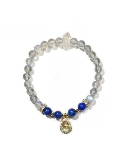 Lovra bracelet arranged with other jewelry pieces on a flat surface