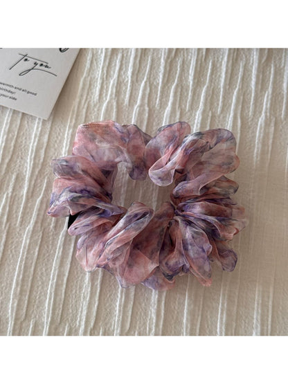 Scrunchie on wrist as a colorful floral accessory