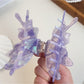 Side view of colorful butterfly hair claw clip highlighting wing shape