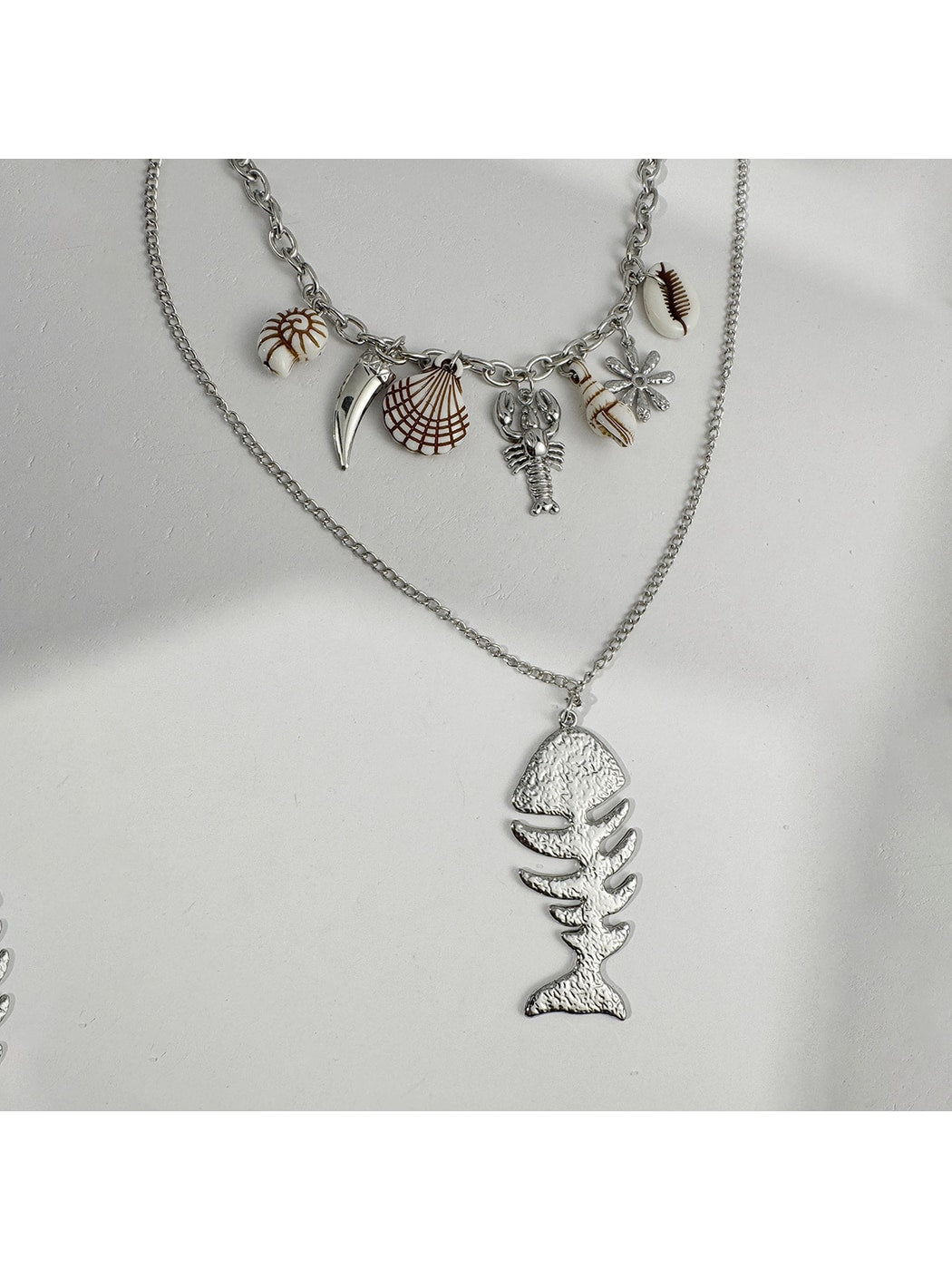 Nozari - Retro Distressed Ocean Charm Layered Necklace