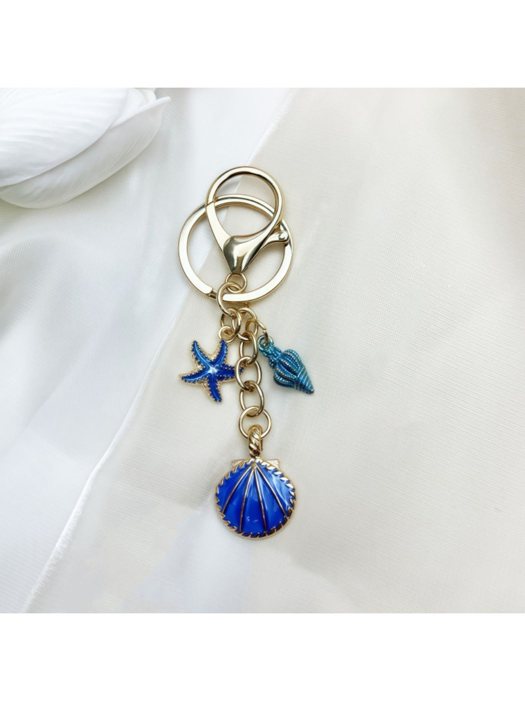 Keypus keychain displayed with other marine themed accessories