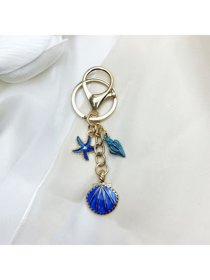 Keypus keychain displayed with other marine themed accessories