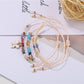 Lovra butterfly pendant bracelet styled with casual outfit on model's wrist