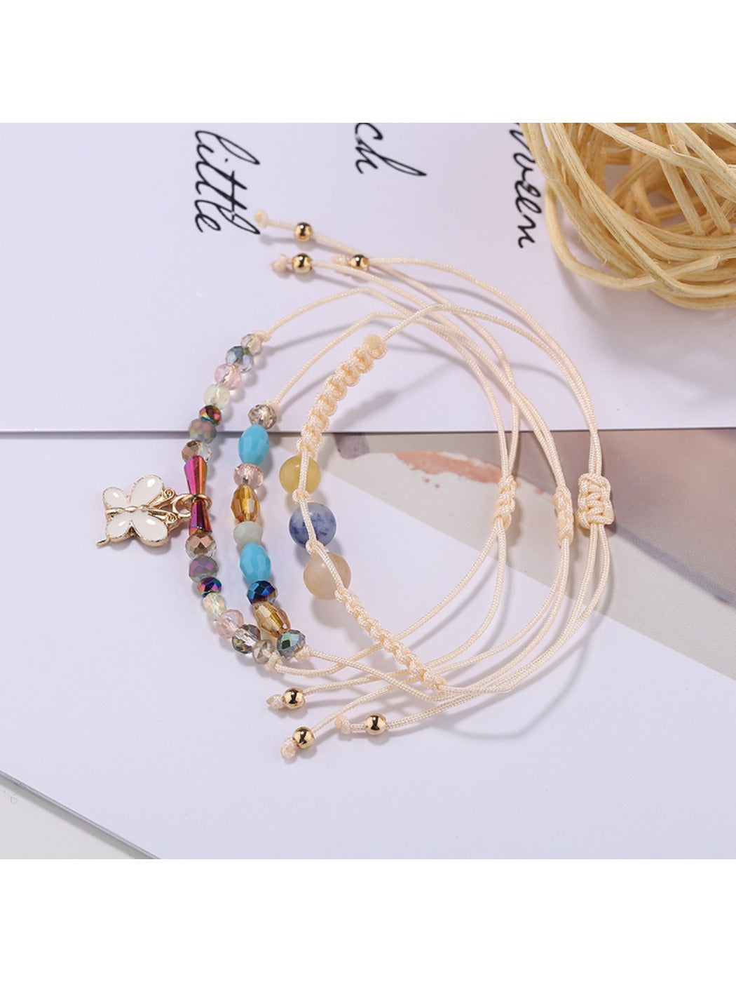 Lovra butterfly pendant bracelet styled with casual outfit on model's wrist