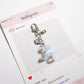 Keypus cartoon bag charm keychain shown from a top-down perspective