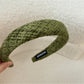 Gifty headband folded to show its flexibility and material quality