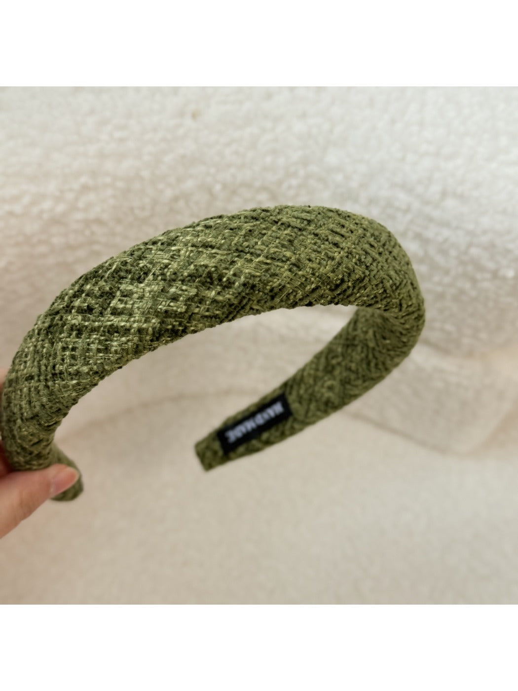 Gifty headband folded to show its flexibility and material quality