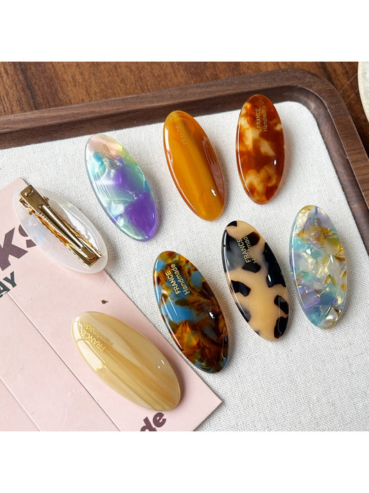 Beau Sweet Oval Acetate Hair Clip in tortoiseshell pattern on white background
