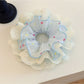 Gifty polka dot lace double layer scrunchie in black with white dots on a neutral background