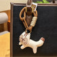 Keypus squirrel charm keychain displayed with other animal-themed keychains