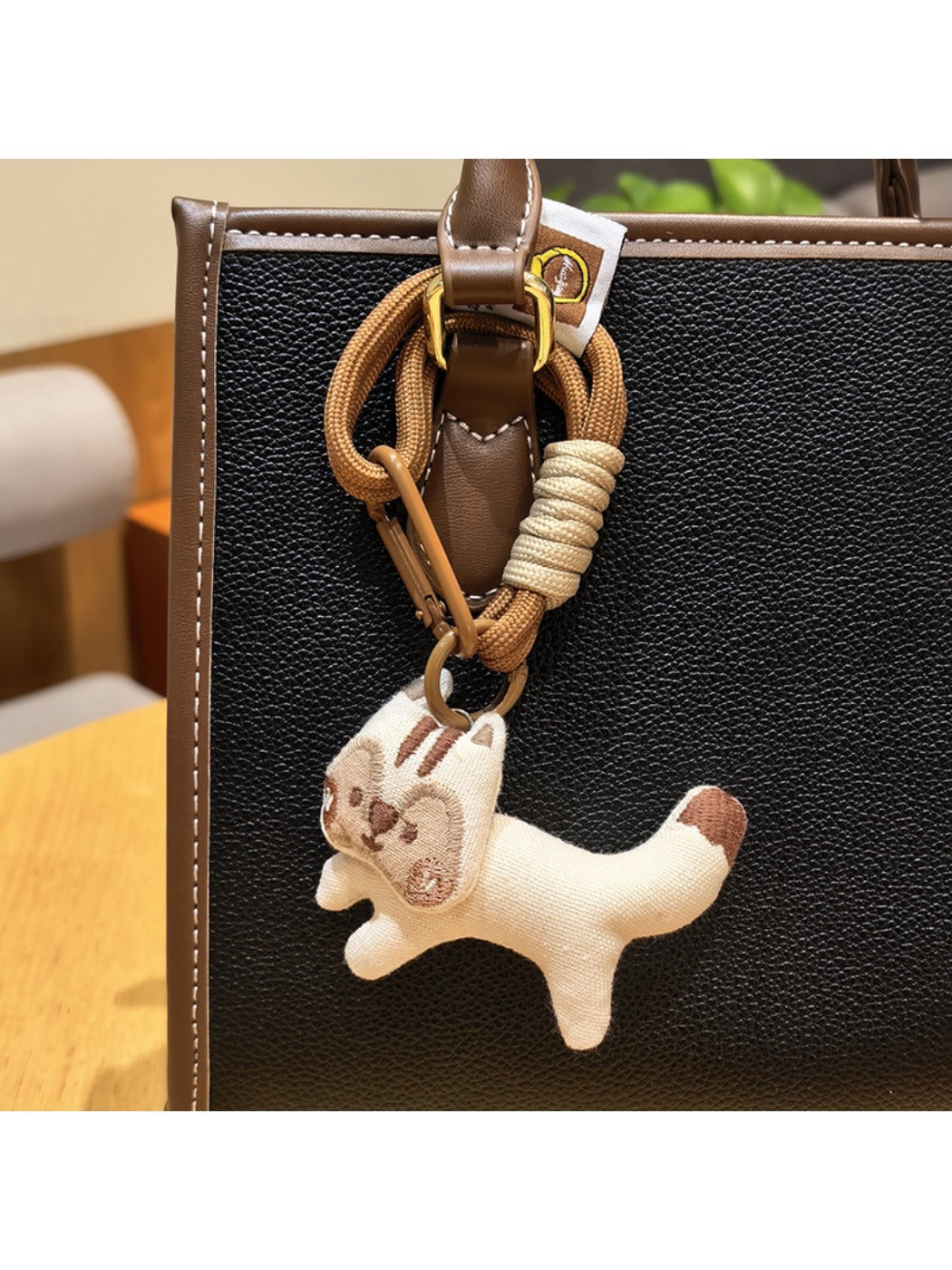 Keypus squirrel charm keychain displayed with other animal-themed keychains