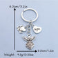 Alloy angel keychain displayed on a white background highlighting its shape