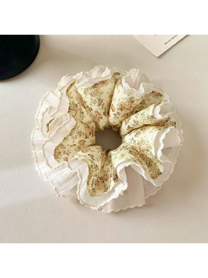 Side view of Gifty vintage floral ruched scrunchie showing fabric texture and elastic