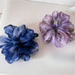 Multi color tulle scrunchie with layered pastel shades on a white background