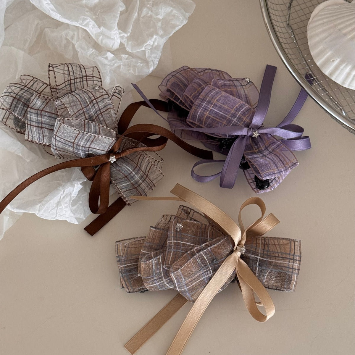 Model wearing Beau checkered bow hair clip in black and white, styled in loose hair