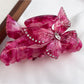 Beau hair claw clip with multicolored butterfly decorations in natural light