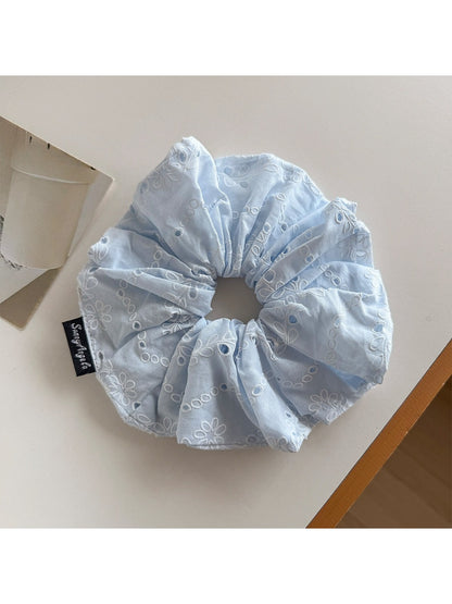 Gifty scrunchie displayed on a white background highlighting texture