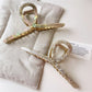 Close-up of Beau vintage crisscross hair claw clip showing interwoven design